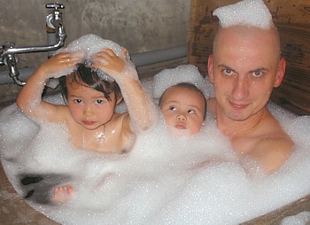 Abbot Muho with kids in the bathtub.